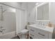 Cozy bathroom with a shower-tub combo, sink and vanity, and nautical-themed decor at 125 12Th E Ave, Palmetto, FL 34221