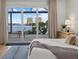 Bedroom showing the view, hardwood floors, modern furnishings, and a comfortable aesthetic at 125 12Th E Ave, Palmetto, FL 34221