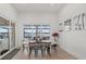 Elegant dining room with waterfront views, modern table and chairs, and natural light at 125 12Th E Ave, Palmetto, FL 34221