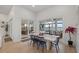 Dining area with waterfront views, a large table, and sliding doors to the outdoor space at 125 12Th E Ave, Palmetto, FL 34221