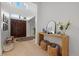 Bright foyer featuring a wooden door, light wood floors, and a console table with decorative items at 125 12Th E Ave, Palmetto, FL 34221