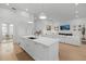 Modern kitchen with a spacious island and open layout to the living area at 125 12Th E Ave, Palmetto, FL 34221