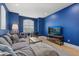 Blue Living room with comfortable seating, large windows, and a TV at 125 12Th E Ave, Palmetto, FL 34221