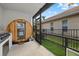 Screened patio featuring a wooden sauna and a grill for outdoor cooking and relaxation at 125 12Th E Ave, Palmetto, FL 34221
