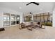 Inviting screened patio featuring a cozy seating area with views of the serene waterfront at 125 12Th E Ave, Palmetto, FL 34221
