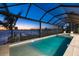 Beautiful pool under screened enclosure offers scenic water views and ultimate relaxation at 125 12Th E Ave, Palmetto, FL 34221