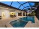 Relaxing pool area with a spa, dining space, and comfortable seating, ideal for outdoor enjoyment at 125 12Th E Ave, Palmetto, FL 34221