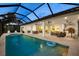 Outdoor living with a private pool, spa, and dining area, perfect for entertaining at 125 12Th E Ave, Palmetto, FL 34221