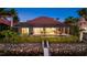 Back of home with an enclosed lanai, pool, dock, and waterfront view offer a private retreat at 125 12Th E Ave, Palmetto, FL 34221