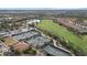 Aerial view of the tennis courts and golf course, illustrating the community's active lifestyle offerings at 12659 Sorrento Way, Bradenton, FL 34211