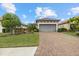 Charming single-Gathering home boasts a paved driveway and lush landscaping at 12659 Sorrento Way, Bradenton, FL 34211
