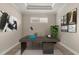 Bright home office features modern desk, neutral decor, and tile flooring at 12659 Sorrento Way, Bradenton, FL 34211