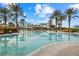 Stunning pool area with a poolside bar, surrounded by palm trees and comfortable lounge chairs at 12659 Sorrento Way, Bradenton, FL 34211