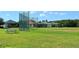 Community baseball field with lush green grass and a picnic table at 13105 Peregrin Cir, Bradenton, FL 34212