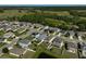 Aerial view of a residential neighborhood surrounded by green spaces at 15408 Trinity Fall Way, Bradenton, FL 34212