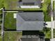 Aerial view of roof and backyard with well-maintained lawn and fencing at 15408 Trinity Fall Way, Bradenton, FL 34212