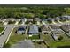 An aerial view of a suburban neighborhood featuring well-maintained homes and green spaces at 15408 Trinity Fall Way, Bradenton, FL 34212