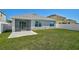 Spacious backyard with a concrete patio area and fully fenced lawn at 15408 Trinity Fall Way, Bradenton, FL 34212