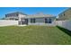 Backyard with screened porch and full lawn at 15408 Trinity Fall Way, Bradenton, FL 34212