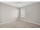 Neutral bedroom with carpet, ceiling fan, and window with blinds at 15408 Trinity Fall Way, Bradenton, FL 34212