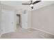 Bedroom featuring neutral walls, carpet, a ceiling fan and access to the other rooms at 15408 Trinity Fall Way, Bradenton, FL 34212