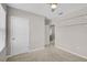 Bedroom with carpet, closet, ceiling fan and adjoining bathroom at 15408 Trinity Fall Way, Bradenton, FL 34212