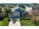 Charming single-Gathering home boasting a well-manicured lawn and inviting curb appeal at 15408 Trinity Fall Way, Bradenton, FL 34212