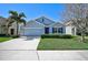 Charming single-Gathering home with a well-manicured lawn and a two-car garage at 15408 Trinity Fall Way, Bradenton, FL 34212