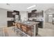 Spacious kitchen features stainless steel appliances and a large center island with seating at 15408 Trinity Fall Way, Bradenton, FL 34212