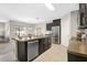 Modern kitchen with a large island, stainless steel appliances, and ample counter space at 15408 Trinity Fall Way, Bradenton, FL 34212