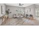 Cozy living room with a comfortable sofa, patterned rug, and plenty of natural light at 15408 Trinity Fall Way, Bradenton, FL 34212