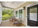 Inviting front porch featuring comfortable seating, perfect for relaxation and enjoying the outdoors at 1623 8Th W Ave, Bradenton, FL 34205