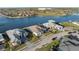 Overview of waterfront homes, showcasing landscaping and canal access in the neighborhood at 1702 4Th St E E St, Palmetto, FL 34221