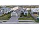 Beautiful home with brick driveway, three car garage, well manicured lawn, and serene water views at 1702 4Th St E E St, Palmetto, FL 34221