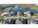 Community view with waterfront homes along a serene canal and boat docks at 1702 4Th St E E St, Palmetto, FL 34221