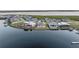 Aerial view of waterfront homes, serene water views, and lush greenery on a sunny day at 1702 4Th St E E St, Palmetto, FL 34221