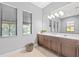 Bathroom with modern fixtures, double vanity, ample storage space, and large windows with blinds at 1702 4Th St E E St, Palmetto, FL 34221