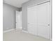 Bedroom with gray walls, white trim and doors, and neutral carpet at 1702 4Th St E E St, Palmetto, FL 34221