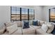 Close up of the large sectional in the bonus room with water views from the window at 1702 4Th St E E St, Palmetto, FL 34221