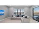 Bonus room features a large window with a view of the waterfront and a comfortable sectional couch at 1702 4Th St E E St, Palmetto, FL 34221