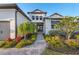 Charming home with well manicured landscaping and a brick walkway leading to the inviting front entrance at 1702 4Th St E E St, Palmetto, FL 34221