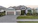 Charming home with a three-car garage, well-kept lawn, and inviting curb appeal at 1702 4Th St E E St, Palmetto, FL 34221