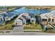 Beautifully landscaped front yard with a paved driveway leading to a three-car garage at 1702 4Th St E E St, Palmetto, FL 34221