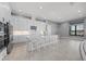 Bright, modern kitchen with white cabinets, stainless steel appliances, and a large center island with bar seating at 1702 4Th St E E St, Palmetto, FL 34221