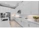 Bright kitchen features custom white cabinets, stainless appliances, and modern tile backsplash at 1702 4Th St E E St, Palmetto, FL 34221