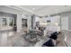 Open-concept living space showcasing a contemporary design with light gray walls and seamless kitchen access at 1702 4Th St E E St, Palmetto, FL 34221