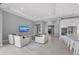 Bright living room with modern furnishings, open to the kitchen and stainless appliances at 1702 4Th St E E St, Palmetto, FL 34221