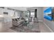 Open-concept living room features a seamless flow to the outdoor space and modern decor and finishes at 1702 4Th St E E St, Palmetto, FL 34221
