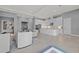 Bright open-concept living area with view of the kitchen and barstool seating at the kitchen island at 1702 4Th St E E St, Palmetto, FL 34221