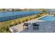 Inviting pool and spa with a covered patio, dining set, and a beautiful sunset at 1702 4Th St E E St, Palmetto, FL 34221